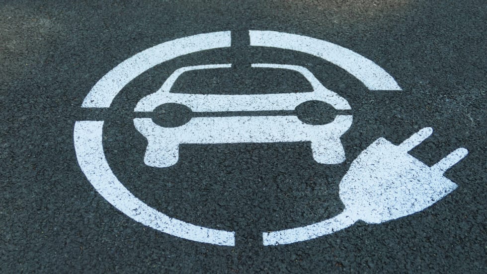 pavement with car and charger wrapped around it painted on