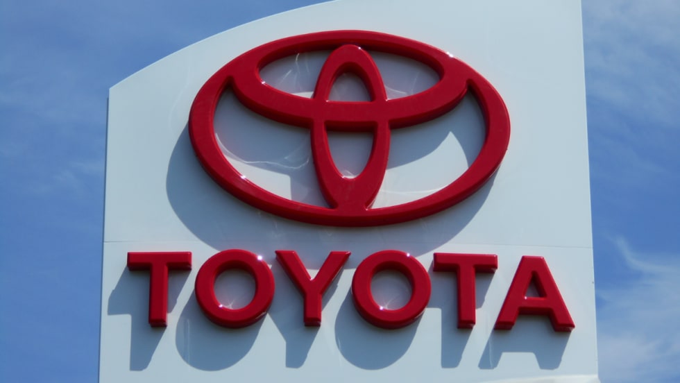 red Toyota name and logo on white building