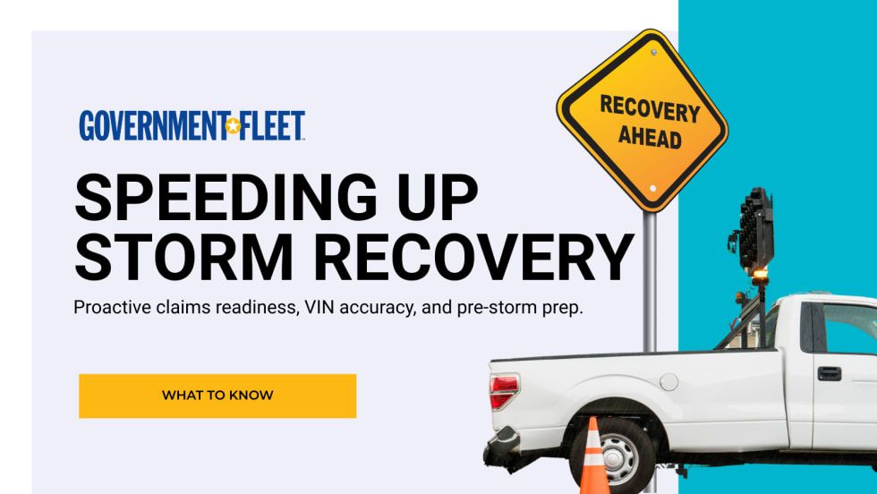 a TRUCK WITH RECOVERY AHEAD SIGN.