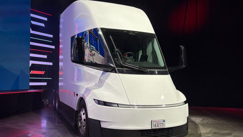 White Tesla Semi electric truck on display on a show floor