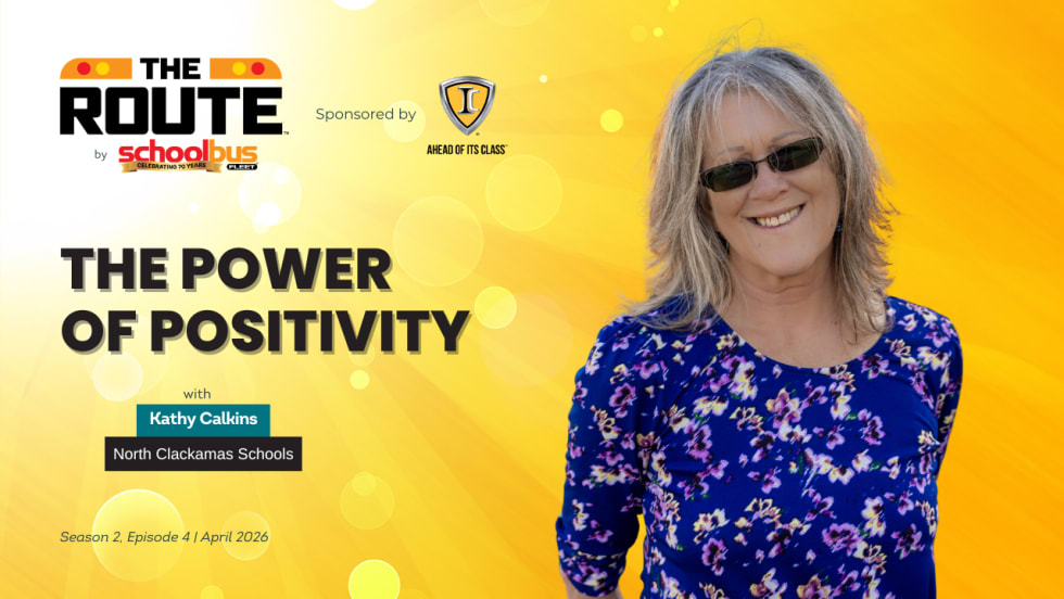 Thumbnail graphic for “The Route” video series featuring Kathy Calkins of North Clackamas Schools, with the headline “The Power of Positivity,” a bright yellow background, sponsor logo, and School Bus Fleet branding.