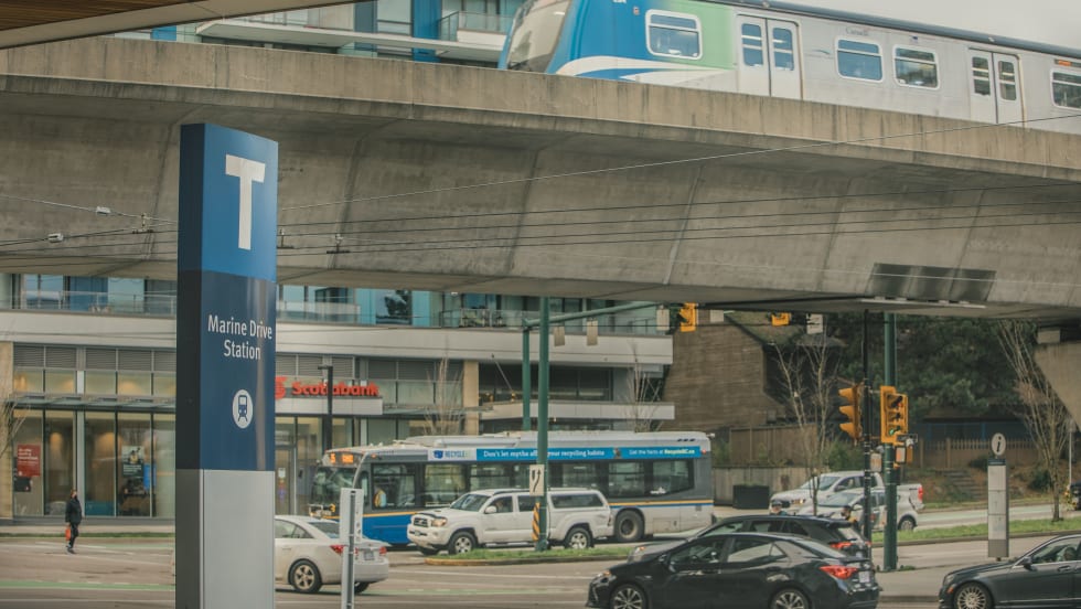 A TransLink bus and rail line in operation. 