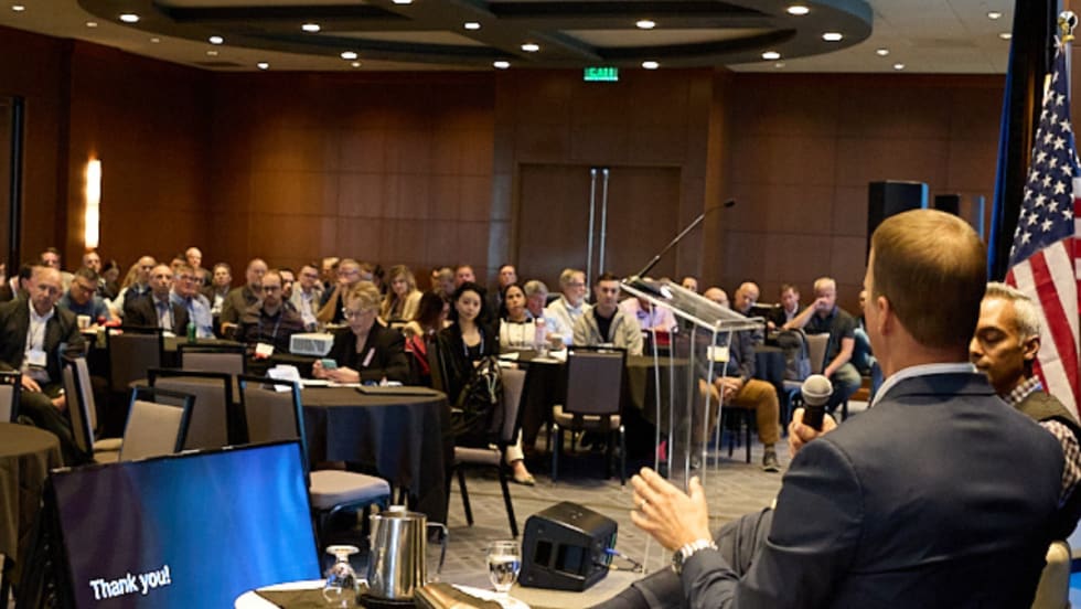 conference attendees watching a speaker