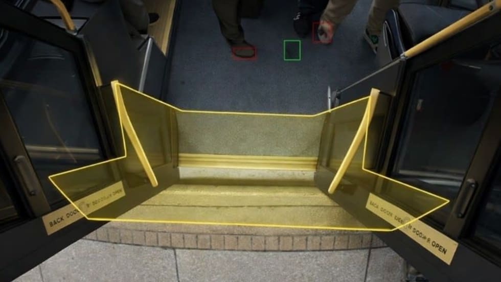 An image of a doorway on a public transit vehicle with a yellow outline overlay.