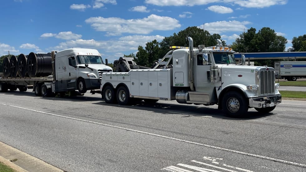 Tractor-trailer being towed.