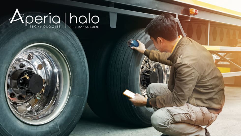 Technician scans truck tire tread depth