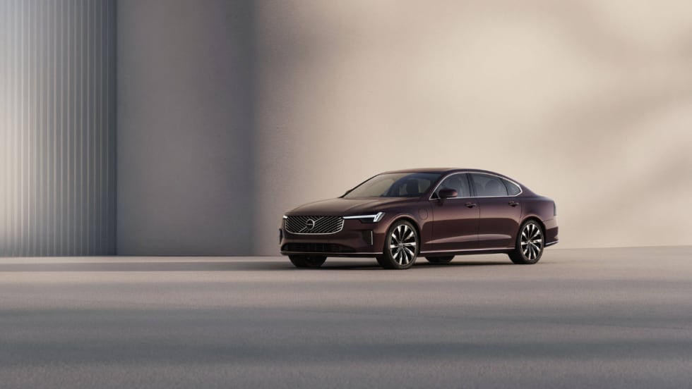 A maroon Volvo S90.