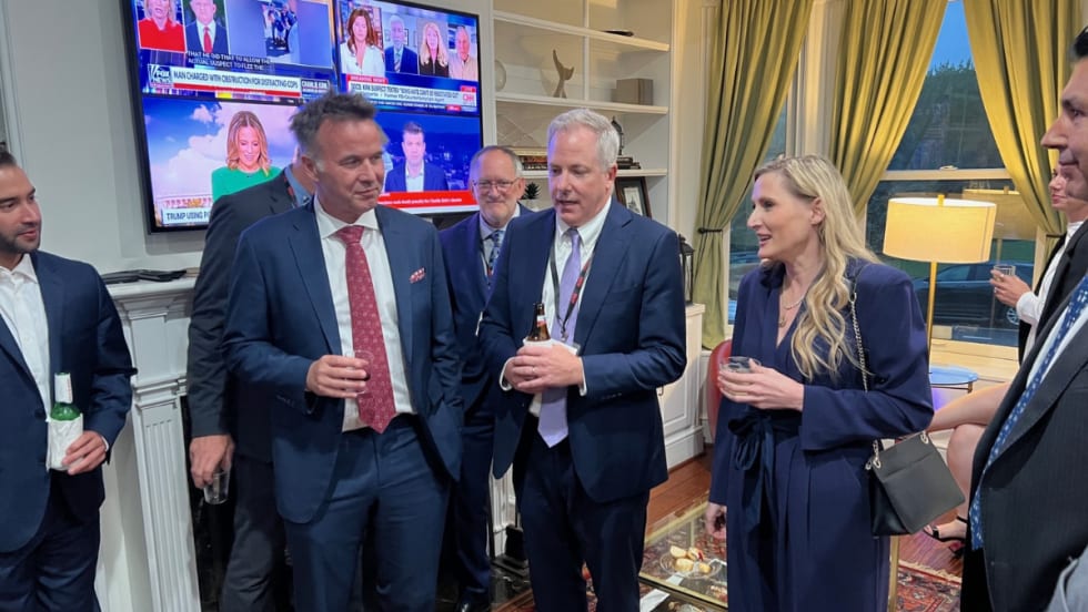 ACRA executives with a Congresswoman in the living room of an event house during a PAC fundraiser.