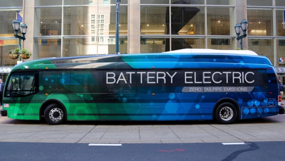 A side view of a blue and green battery electric SEPTA bus. 