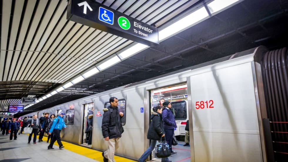 Riders boarding at a Toronto rail station.