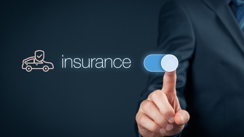 finger swiping car insurance button on