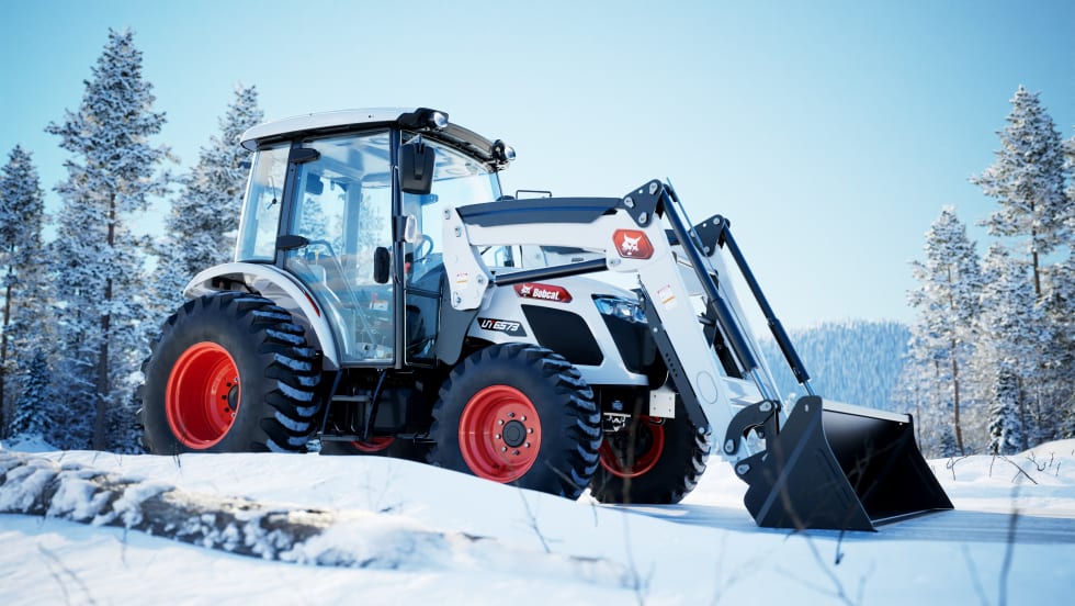 A white Bobcat UT6573 is shown sitting in a snowy setting.