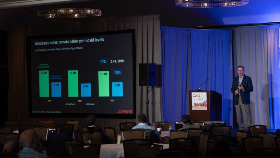 David Sargent of JD Power speaks on stage at CAR Conference.