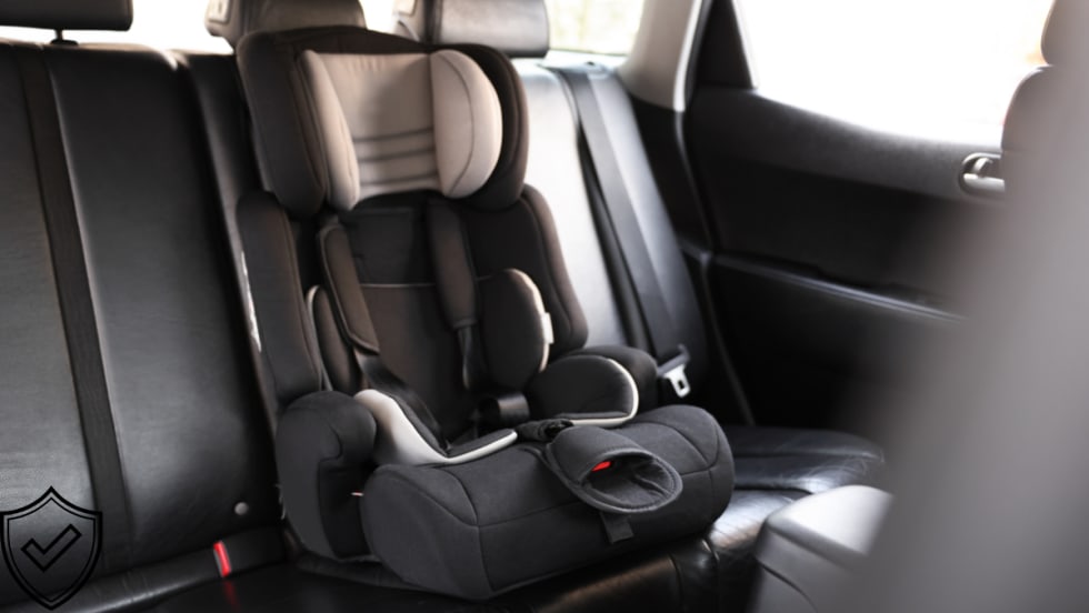 car seat in back seat of car