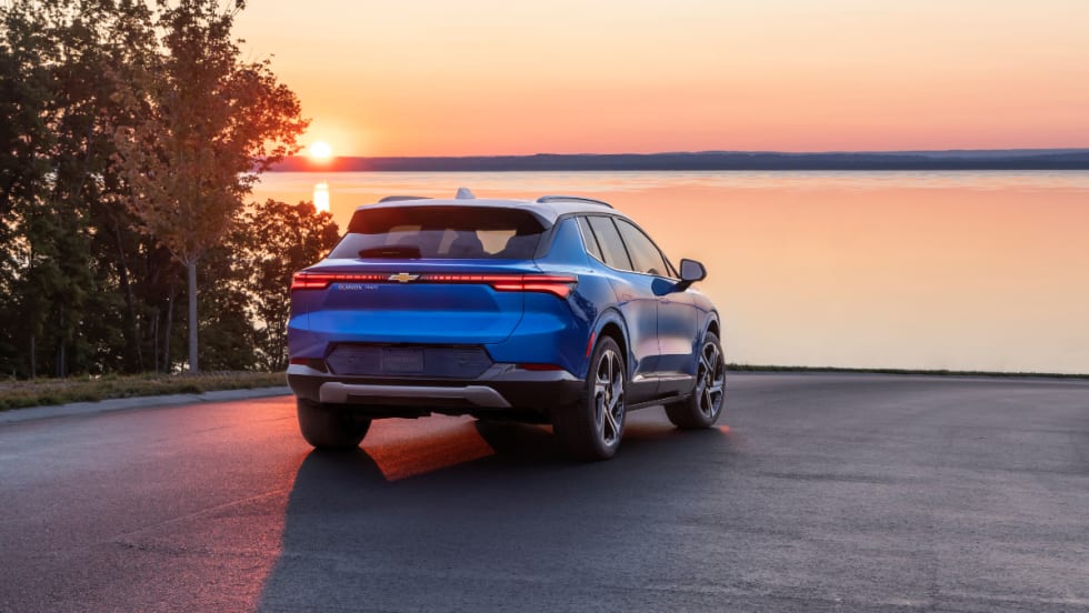 blue 2025 Chevrolet Equinox parked in front of water