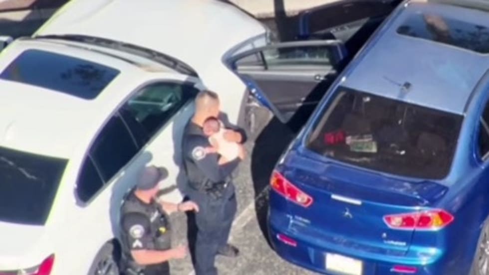 Police officers rescue baby from hot car in California