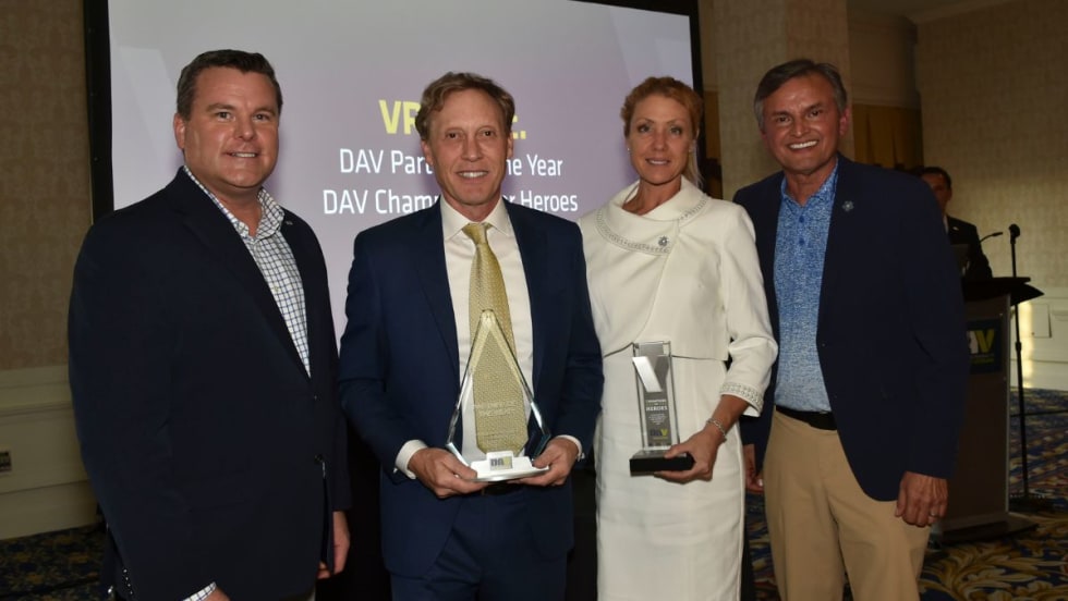 Award winners holding plaques at national DAV awards ceremony.