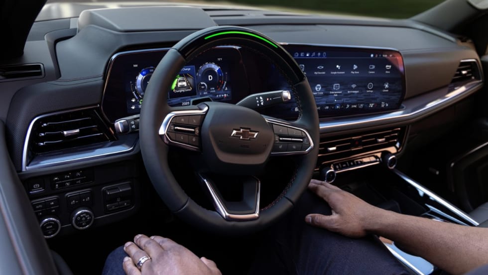 A driver sitting in the passenger seat of a 2025 Chevrolet Tahoe RST while Super Cruise pilots the vehicle.