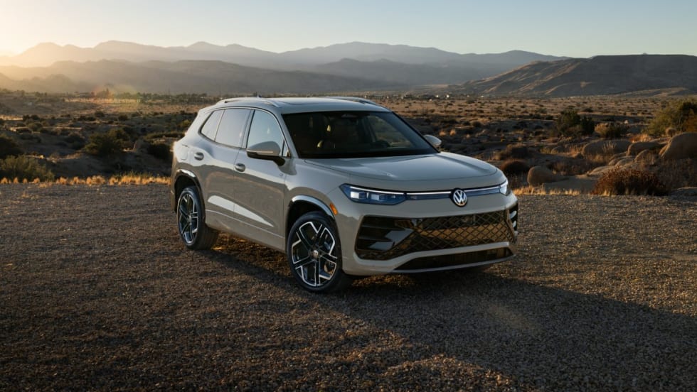 A 2025 Volkswagen Tiguan during sunset with mountain in the background.