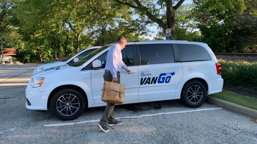 Driver enters Pace VanGo vehicle.