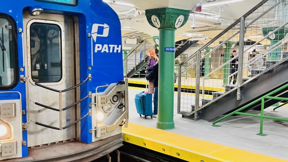 A PATH commuter rail at a Hoboken station reopening.