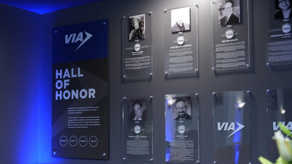 VIA's Hall of Honor wall with all inductees pictured.
