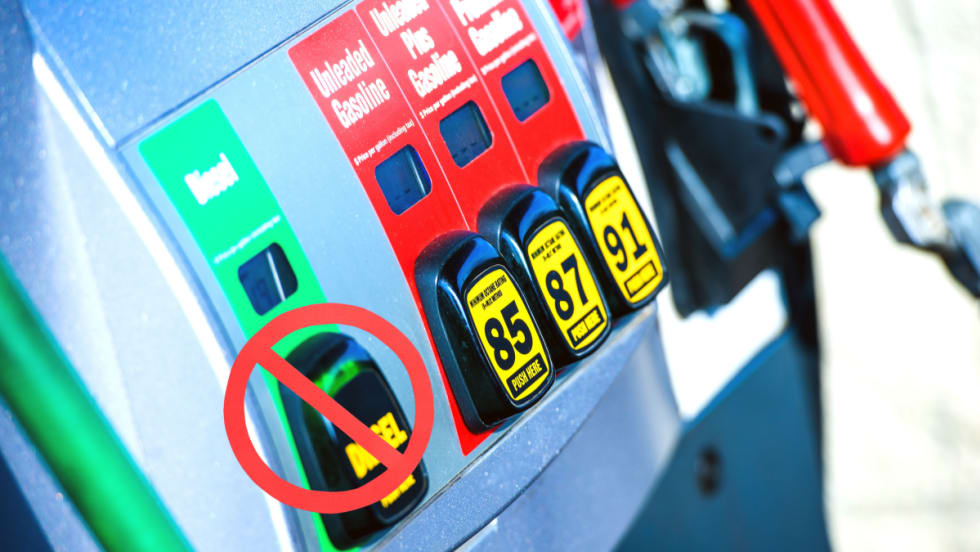 row of fuel nozzles, diesel nozzle has ban circle over it.