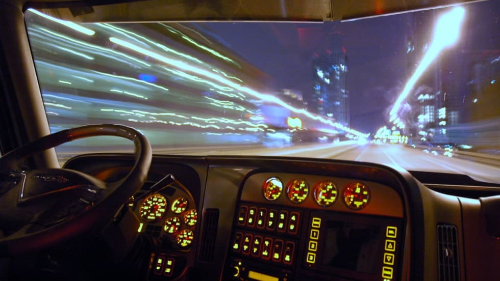 Blurry truck driver at night. 