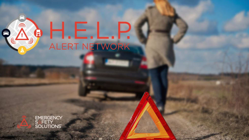 A woman walking toward her disabled car on the side of the road with a roadside alert triangle on the ground. 