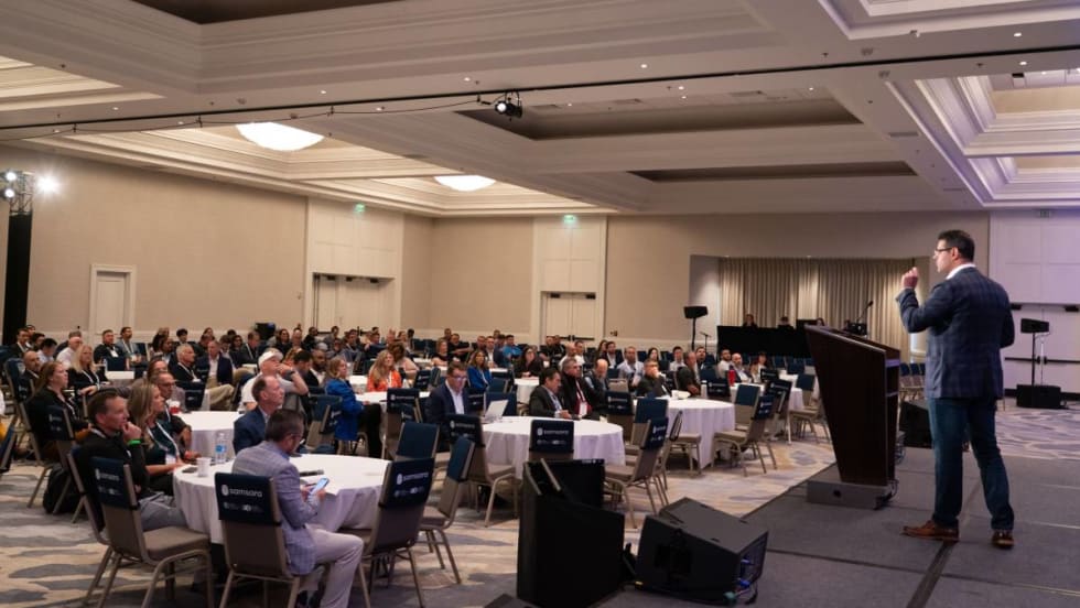 A room of people attending a Fleet Forward Conference seminar.