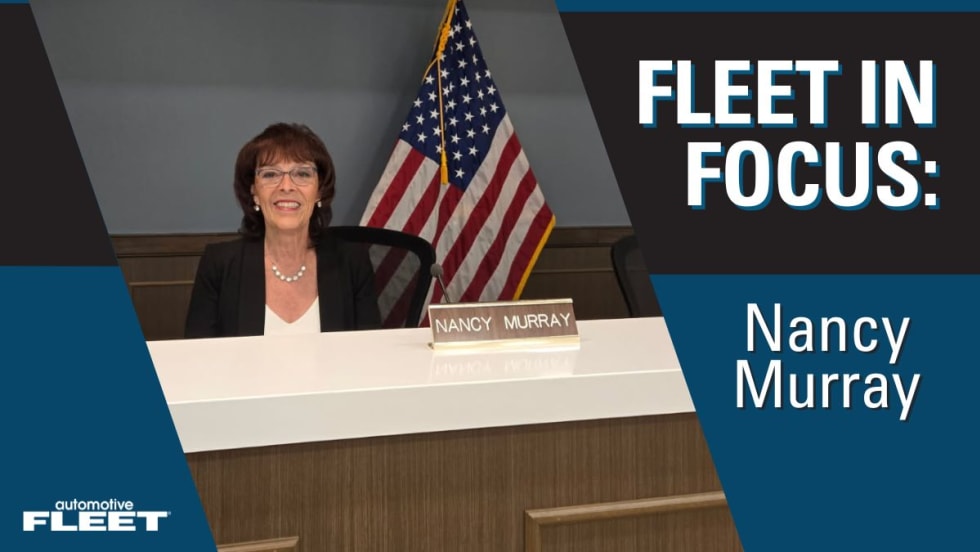 A blue Fleet in Focus graphic with Nancy Murray sitting behind a desk, smiling at the camera.