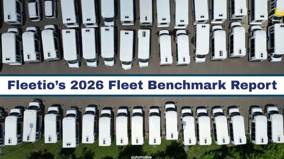 A white fleet of vans are parked across from each other with text in between them in the center of the page. 