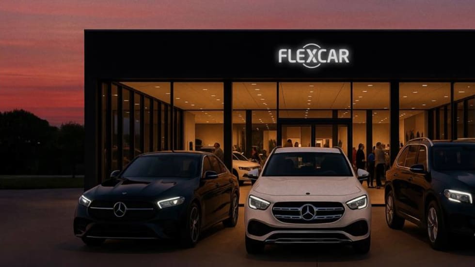 
Three Mercedes-Benz luxury models lined up in front of modern glass-paned showroom.
