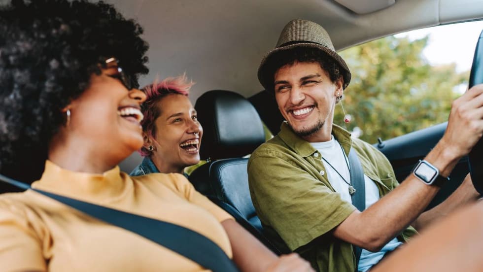 Three Gen Zers are enjoying a rental car.