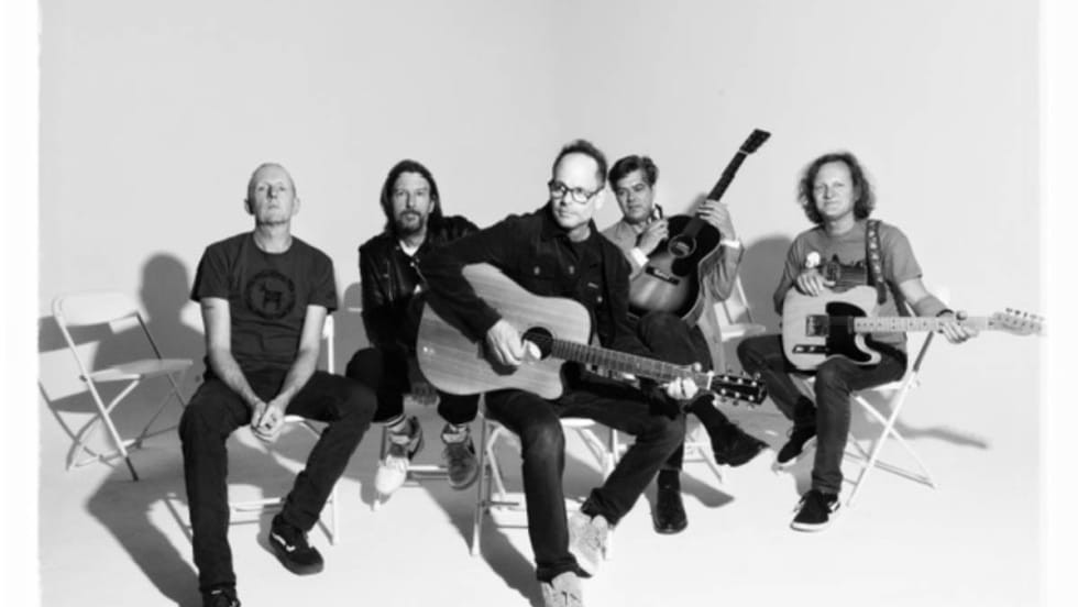 The five members of the Gin Blossoms band with their instruments.
