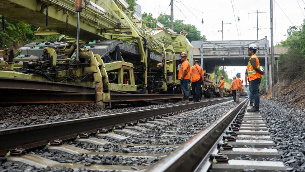 Workers replacing tracks along Amtrak's Harrisburg line.