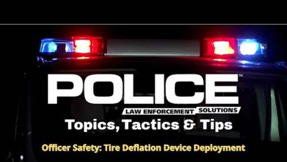 Police emergency lights with text about tire deflation tactics