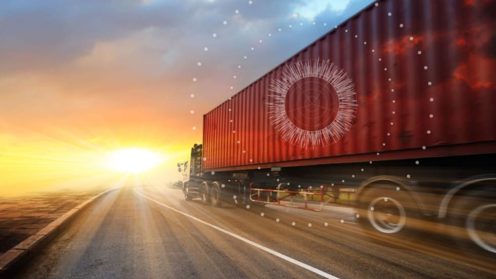 Illustration of an intermodal container on the road going into a sunset or sunrise with internet of things graphics.