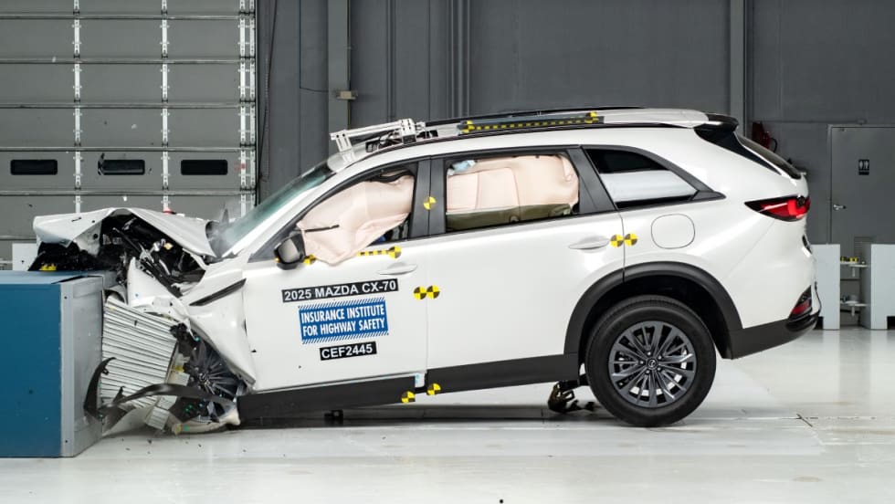 A white 2025 Mazda CX-70 during the updated moderate overlap front crash test.