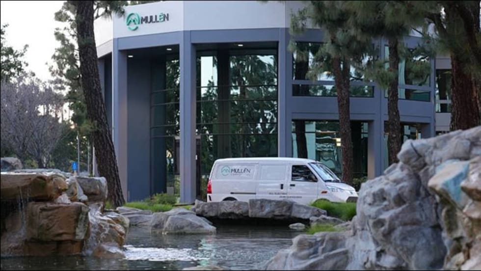 A Mullen Automotive van outside a Mullen facility.