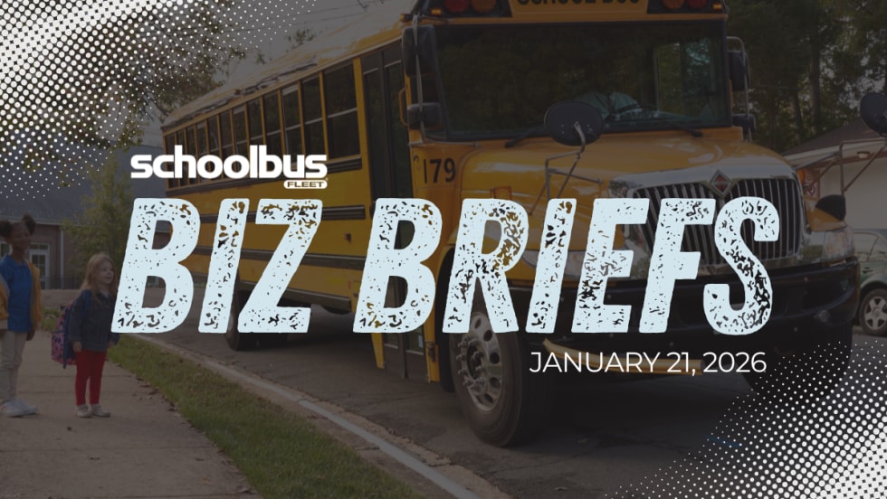 Two young students wait at a bus top while a school bus drives up with text reading "Biz Briefs."