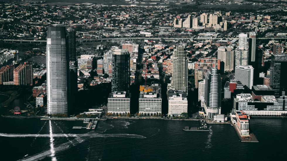 An aerial photograph of Jersey City, New Jersey, during the day.