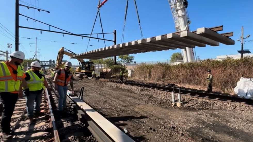 Image of construction workers working on a rail site.