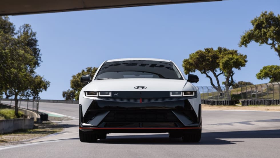Front view of a white 2025 Ioniq 5 N parked on a road.