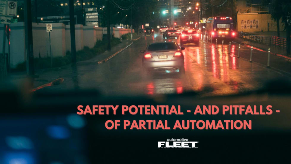 View of a city street at night with text that reads "Does Partial Automation Have Safety Benefits?"