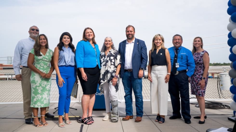 A group of CapMetro professionals posing for a photo.