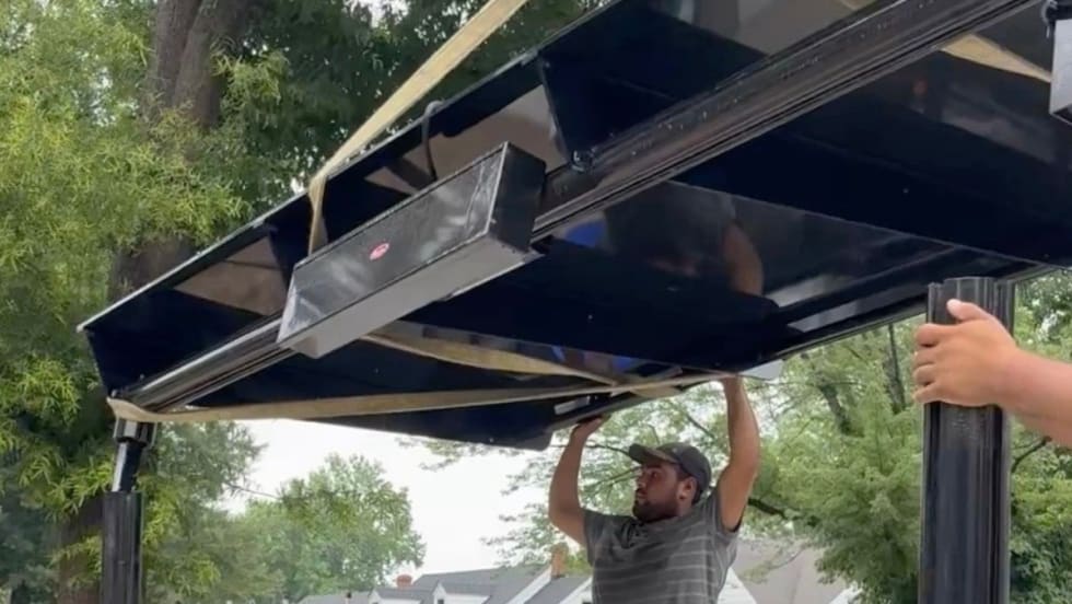 Workers constructing and upgraded a GRTC bus stop.