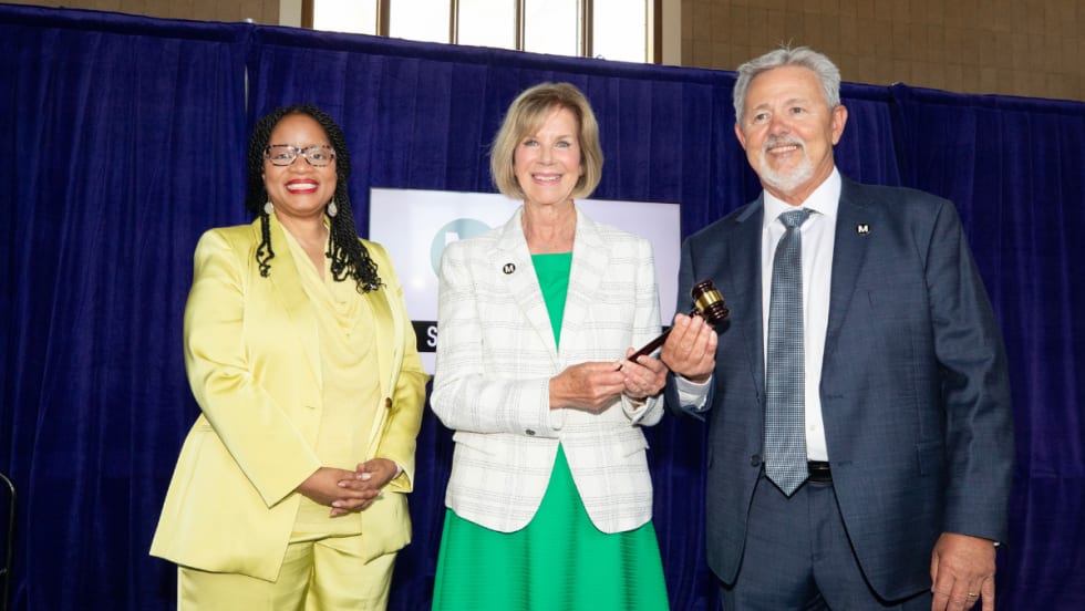 Metro CEO Stephanie Wiggins (left) poses with LA County Supervisor and former Metro Board Chair Janice Hahn (center) as she passes the gavel to incoming Board Chair Fernando Dutra (right).