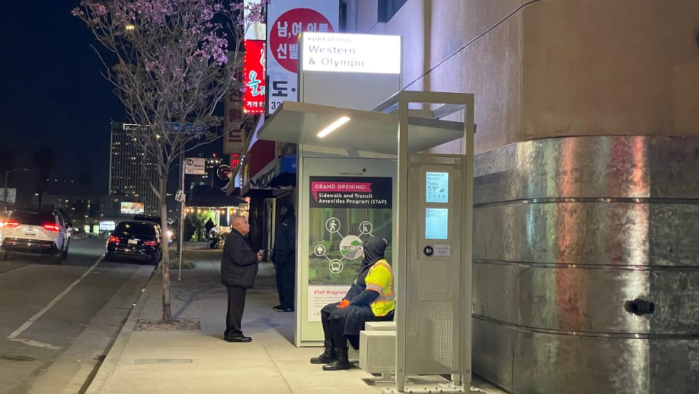 An LA Koreatown Tolar bus shelter at night.