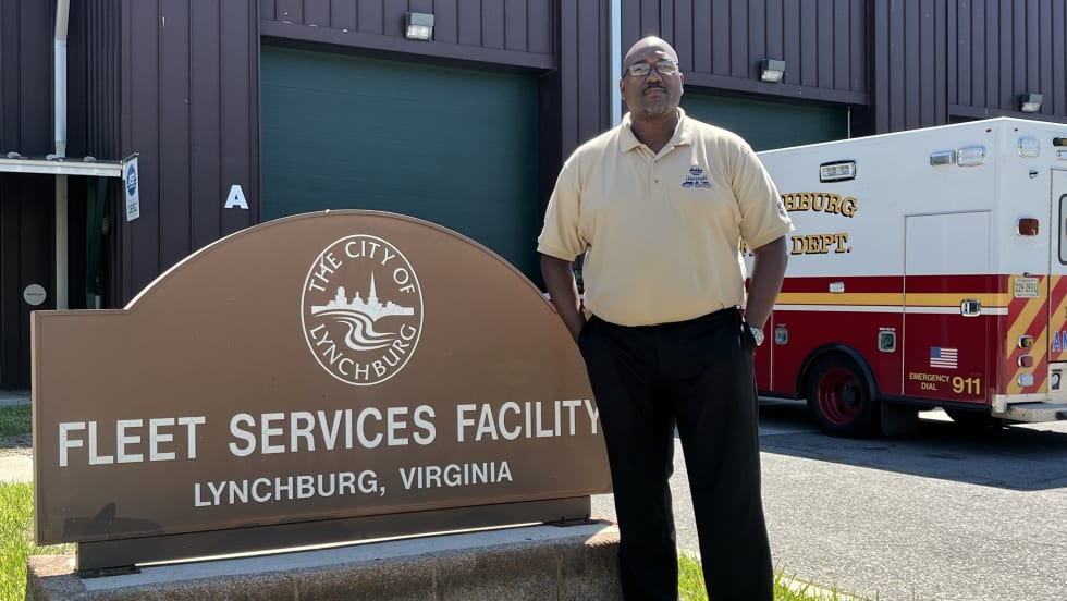 Ken Lett in front of the city fleet building.